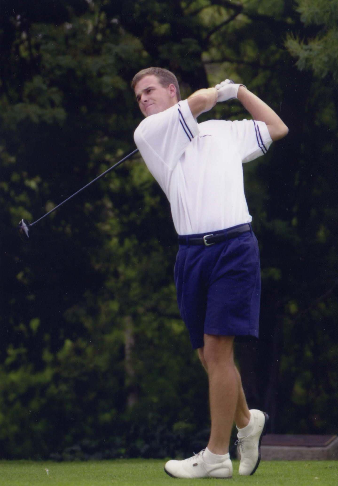Eric playing golf in college