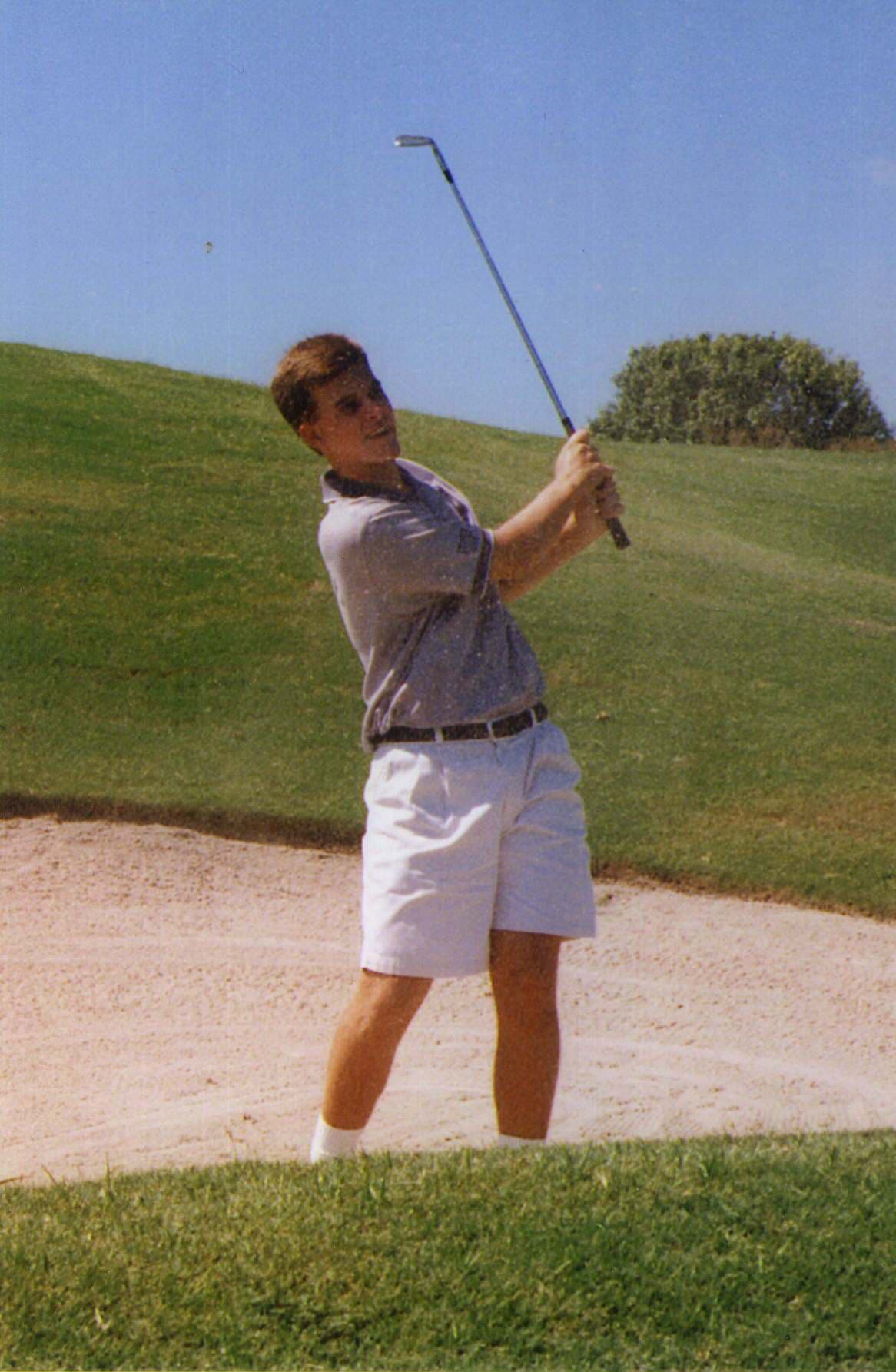 Eric hitting out of a bunker